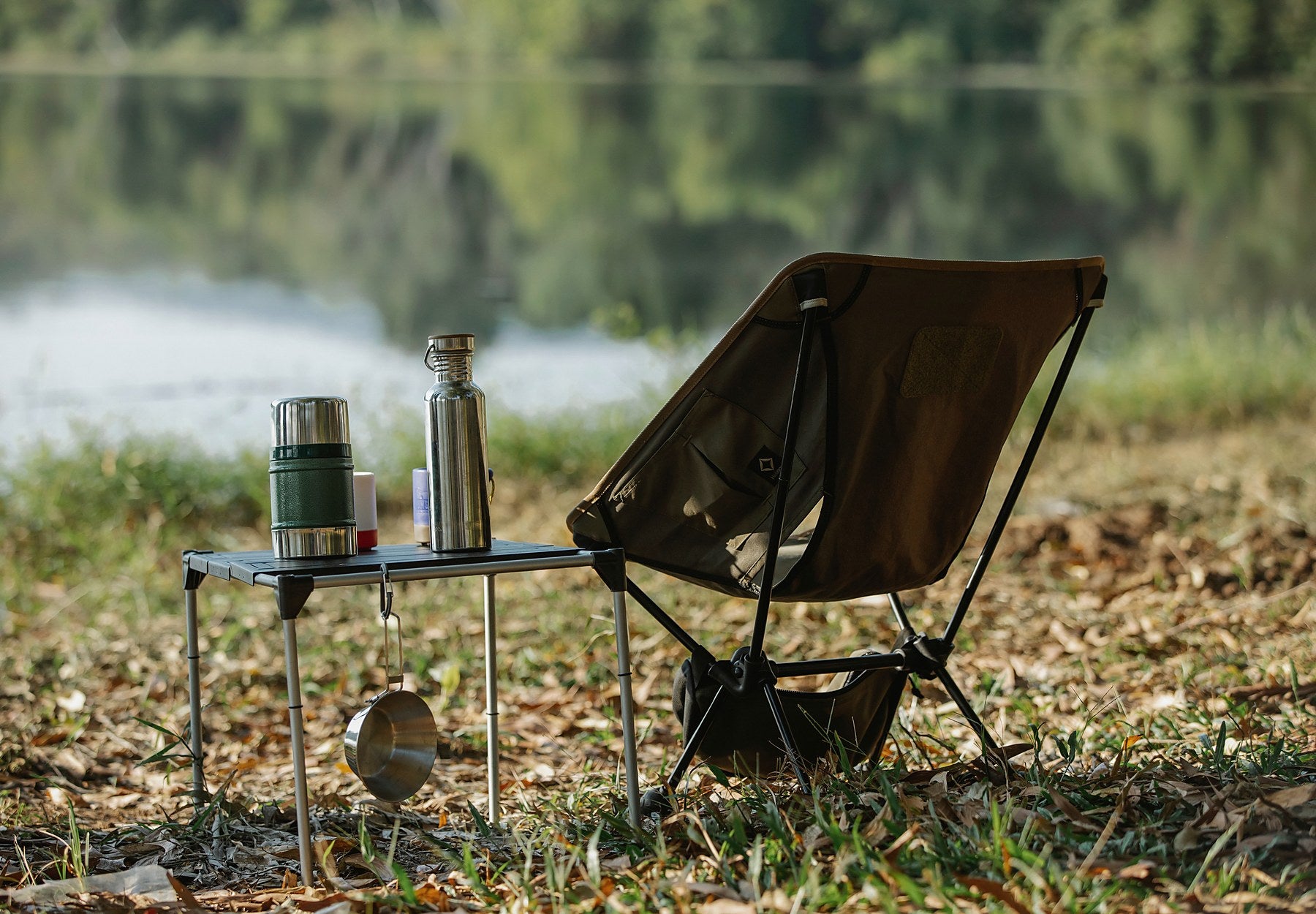Close detail of a folding camping chair and compact table